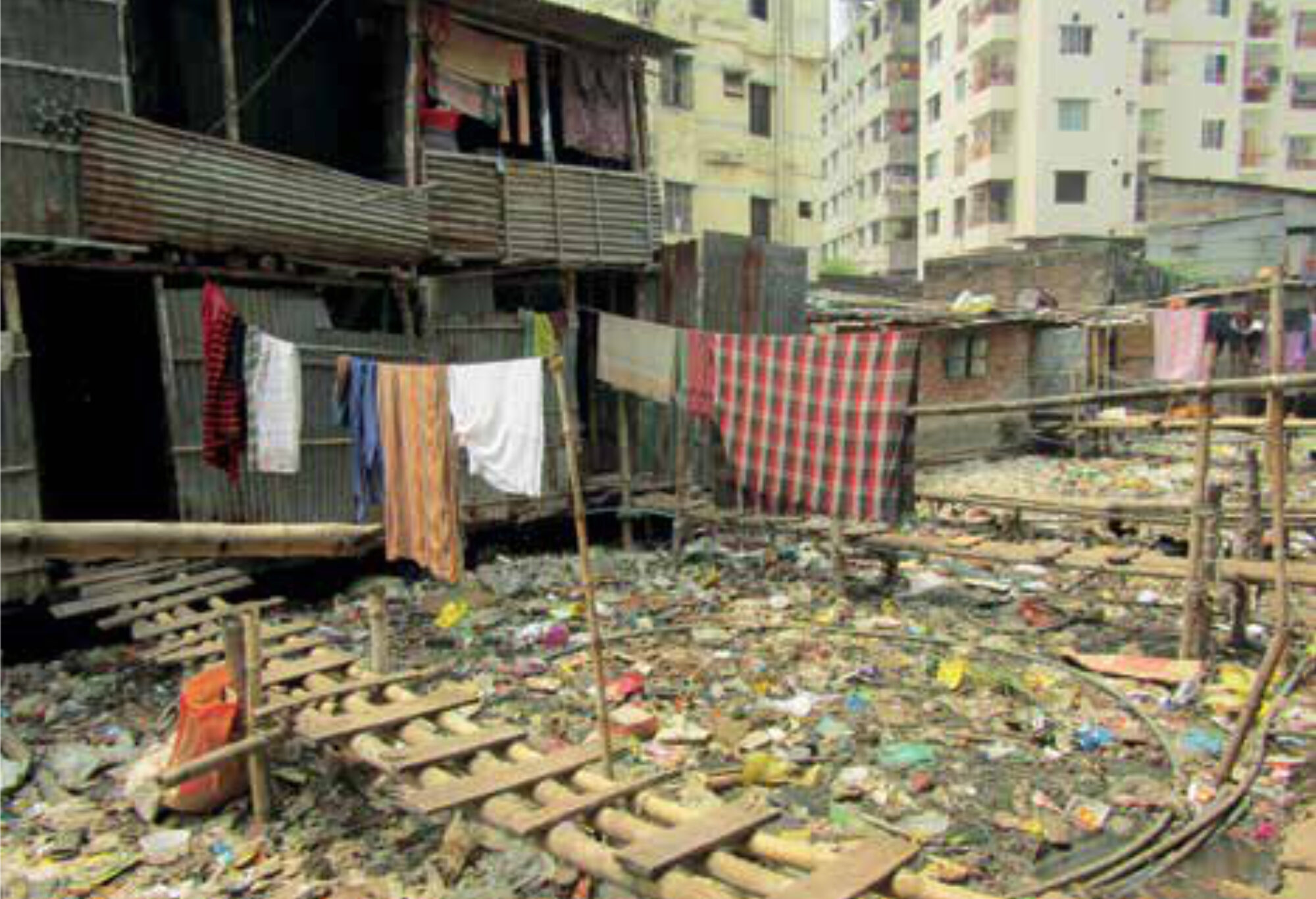 A typical waste disposal in a slum dwelling in Dhaka City (Bashpotti Slum, Mirpur, Dhaka).
